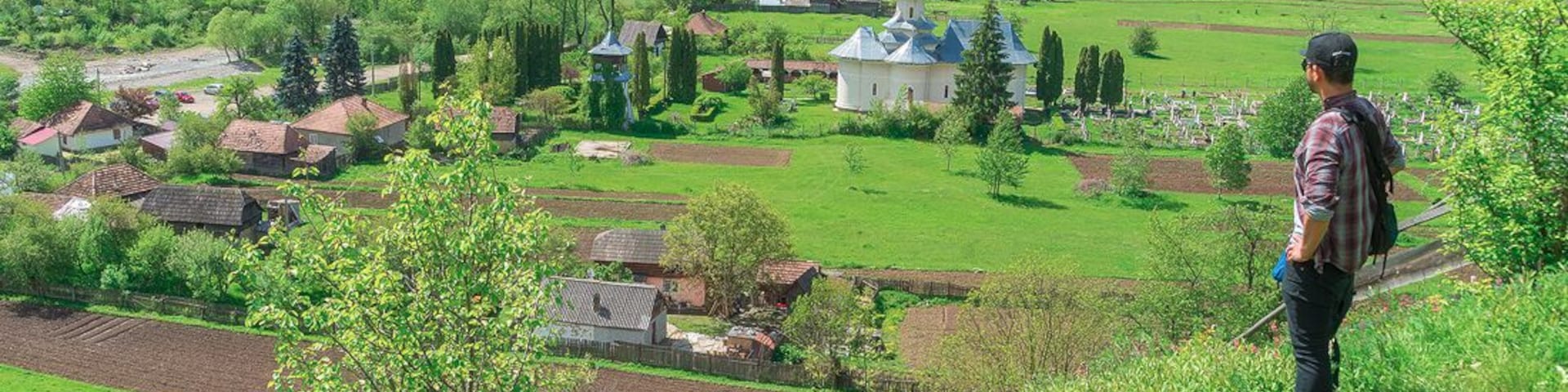 Ghimes (Fage) is a Hungarian town that used to be the border of the Austo-Hungarian empire. Here I'm literally straddling the border overlooking a Romanian village.
http://www.alwayswanderlust.com/straddling-the-border-of-the-austro-hungarian-empire/