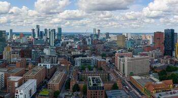 Aerial view of Manchester’s skyline with clustered tall modern towers photographed over Ancoats area.