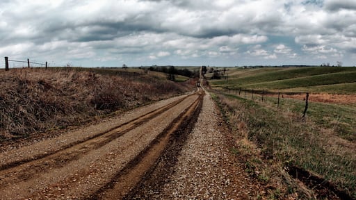When I think road trip I think Bob Seger. A Harley driving down a straight road that seems to go all the way to the horizon. Peaks seem to dot the horizon beckoning you to come climb them. You may be alone or you may be riding with your closest friends. Friends you have had since highschool. This is the time you all have dreamed. The air pushes on your chest as you throttle up making your muffler scream. There is no destination only where you have been.
Road trips are the base desire to leave the comfort of your own home and explore something you have only dreamed of. It is a time of growth. A true road trip cannot be planned; it must be experienced as something as wild as your passion. Each day you wake up and look at which direction to go…North, calling the passions of those who dare the road less traveled, South, Calling for those who want something and untraveled, West, Land of new adventures and sunsets, and East, Where you find you can go back in time and explore your roots.
My road trip took me to Idaho. A state I had only crossed before, but never gave it much credence. A few days before I had met my new cousin, a little girl just was coming into this world. Instead of heading back to my home, 800 miles away, I stowed away my camping gear and made sure I had a loaf of bread and some peanut butter and jelly. I traveled North towards Idaho, a place few have a calling. I wanted to experience what middle America had to offer. To understand what it meant to be American. Expecting cul-de-sacs with 10 year old boys playing street baseball I set off. What I found was far different. As I drove into Idaho I found Amish farmers on wagons, farming equipment sitting in lawns, and American History. Reading historical markers seems to be my thing. I found where Bingham Young called home for a few years, the only battle in Idaho during the Civil War, and a hotel that had the names of every guest for the past 120 years. Each day I woke up with no ambitions or expectations. Just the continuation of where the road would take me. I stopped in at dives trying breakfast in mid afternoon just because. It was an enlightening experience, one that freed me of normal desires during traveling.
http://www.trover.com/d/R5UH-road-bloomfield-iowa
for the story