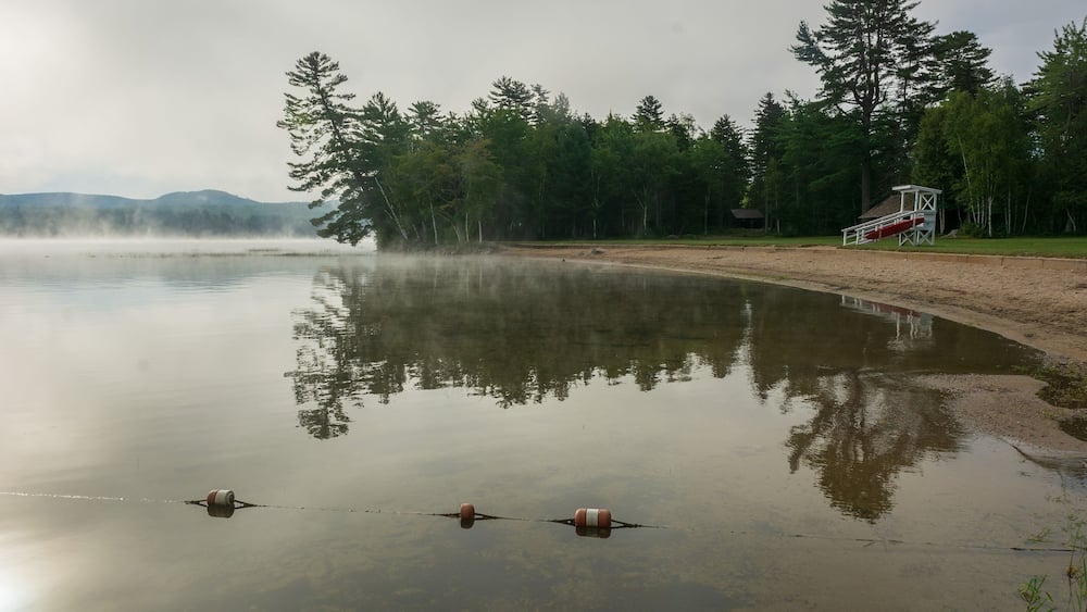 Foggy morning view of Webb Lake from Mt. Blue State Park campground