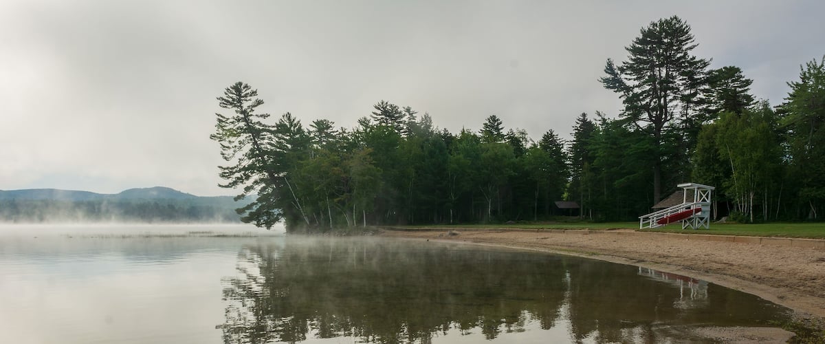 Foggy morning view of Webb Lake from Mt. Blue State Park campground