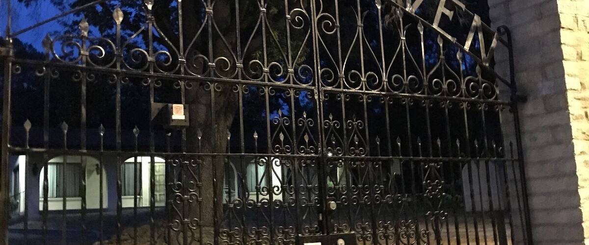 A metal gate with the words "ROCK HAVEN" engraved on it.