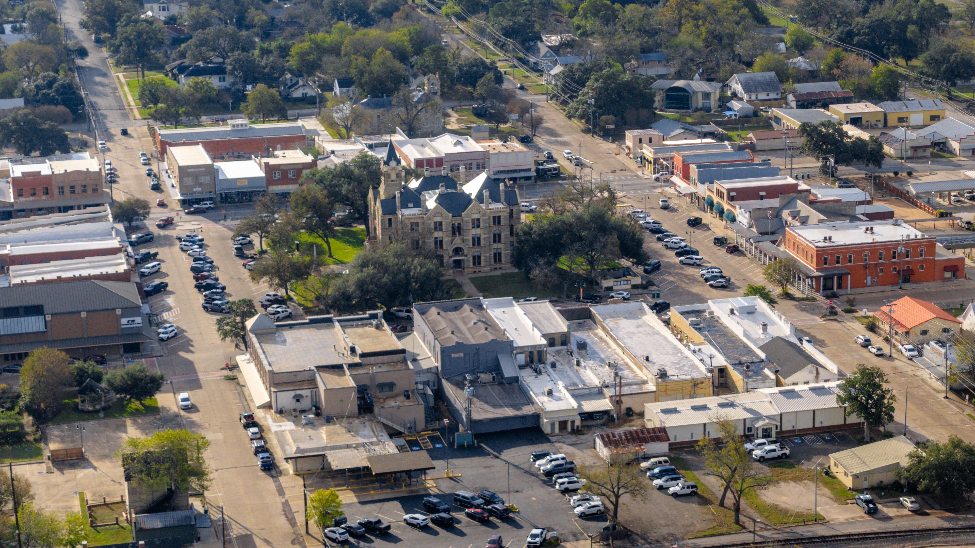 La Grange, Texas, USA - December 2, 2025   Aerial view of West Travis Street, La Grange on an overcast fall afternoon.