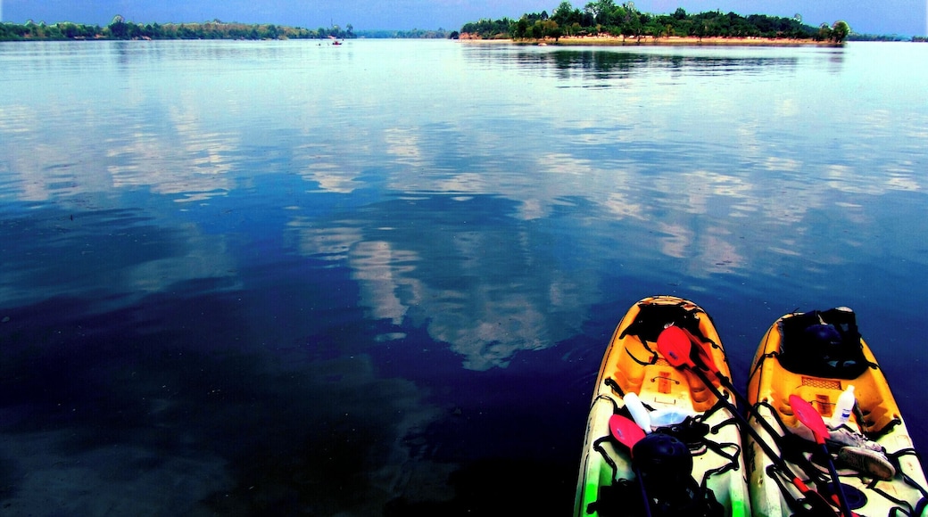Kayaking to Khone Phapheng Falls, the largest waterfall in SE Asia from Don Det in Laos, here we are waiting to see the rare Irrawaddy dolphins on the Mekong River by the boarder with Cambodia. After this was taken, they did appear but far away, but whilst waiting we were blessed with the wonderful views like this where the water was crystal clear turquise with flecks of gold everywhere. Blue everywhere, #Blue Travel Photo Contest #Laos #DonDet #MekongRiver #Irrawaddydolphin #Kayaking
