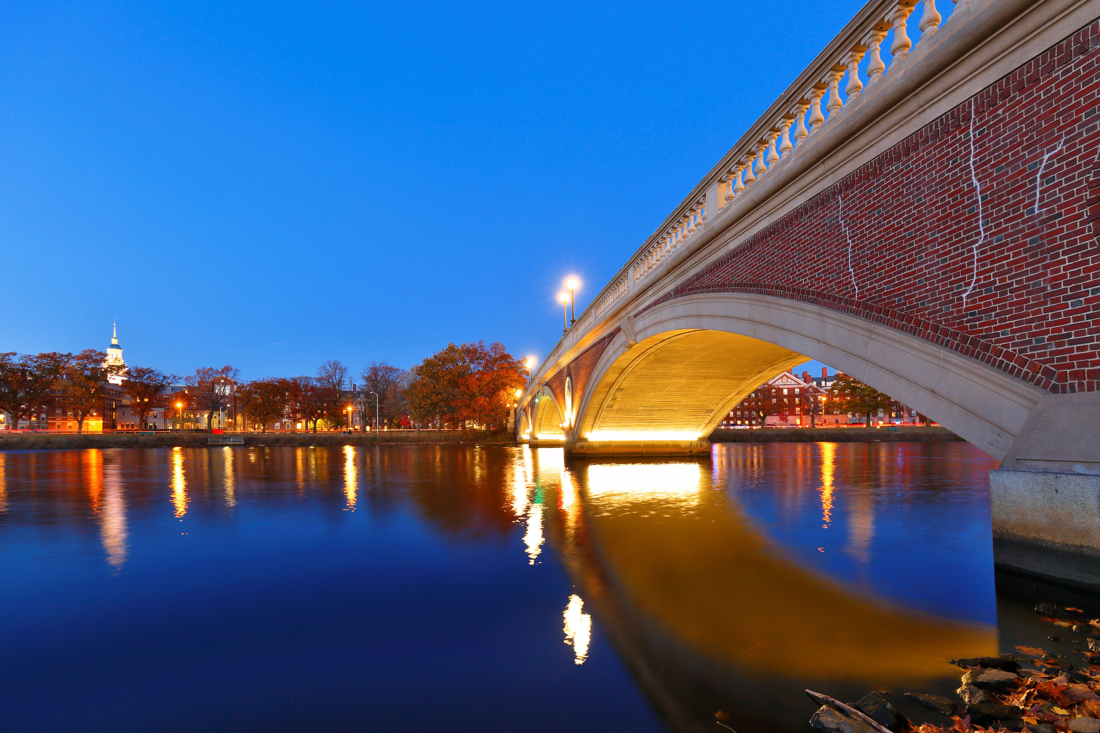 Dunster House and John Weeks Bridge on campus of Harvard University at sunset. Harvard University is a private Ivy League research university in Cambridge, MA.