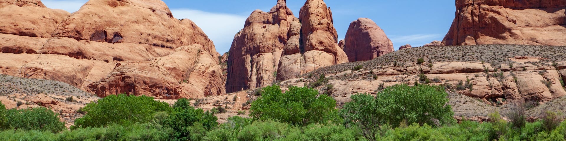 Water view from the Colorado River along the bluffs and rock sculpture outside Moab, Utah