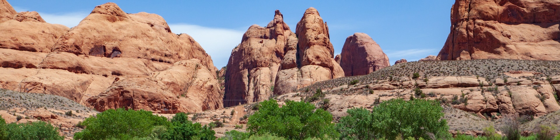 Water view from the Colorado River along the bluffs and rock sculpture outside Moab, Utah