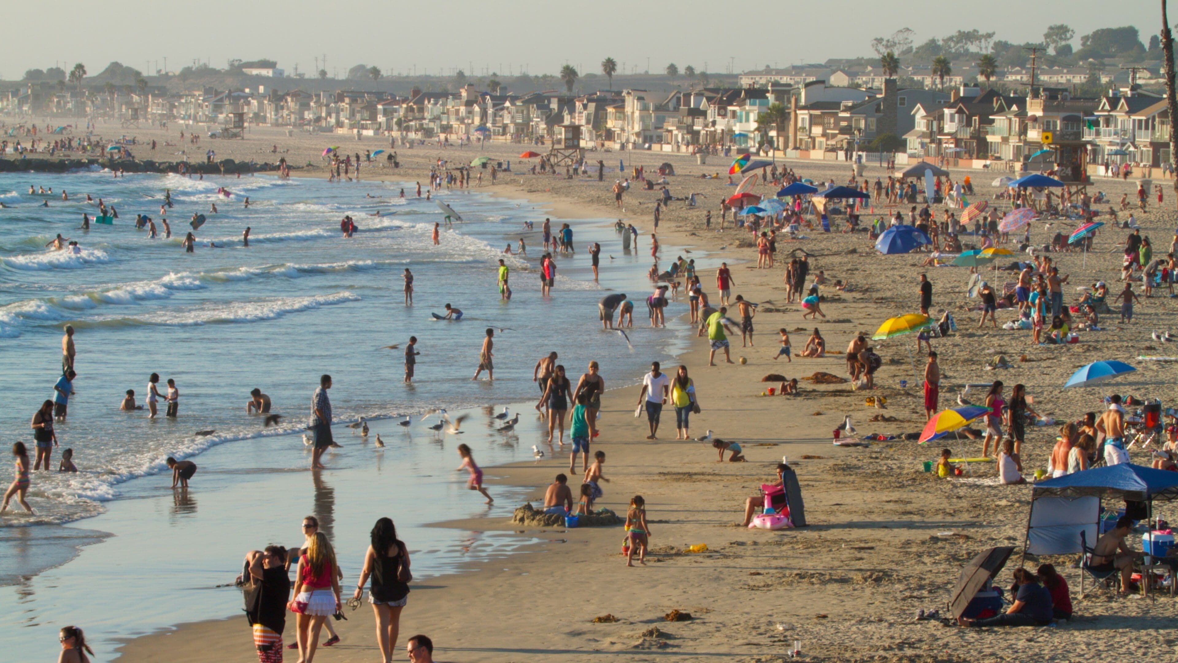 Newport Beach which includes general coastal views as well as a large group of people