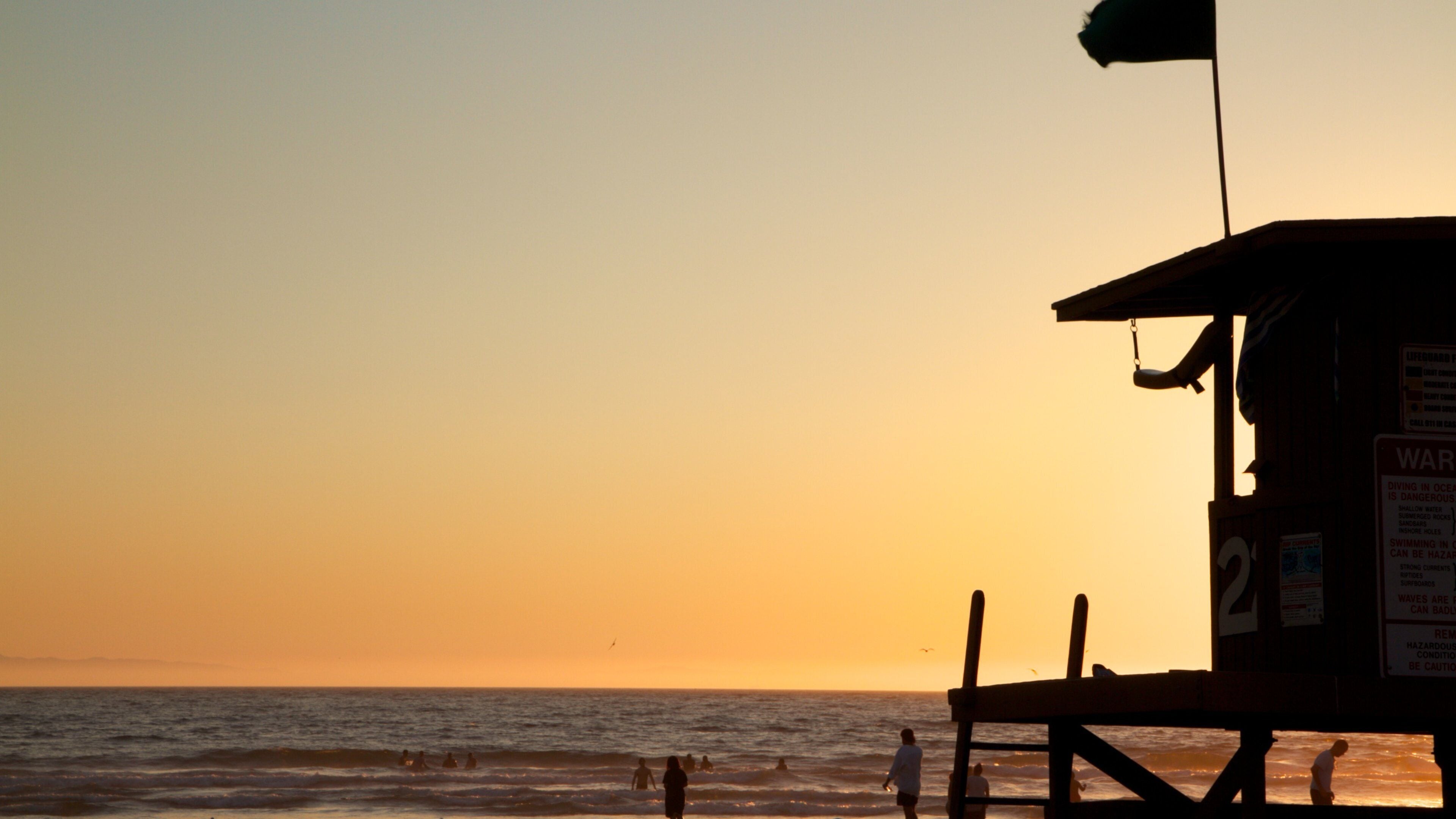 Newport Beach showing a beach, general coastal views and a sunset