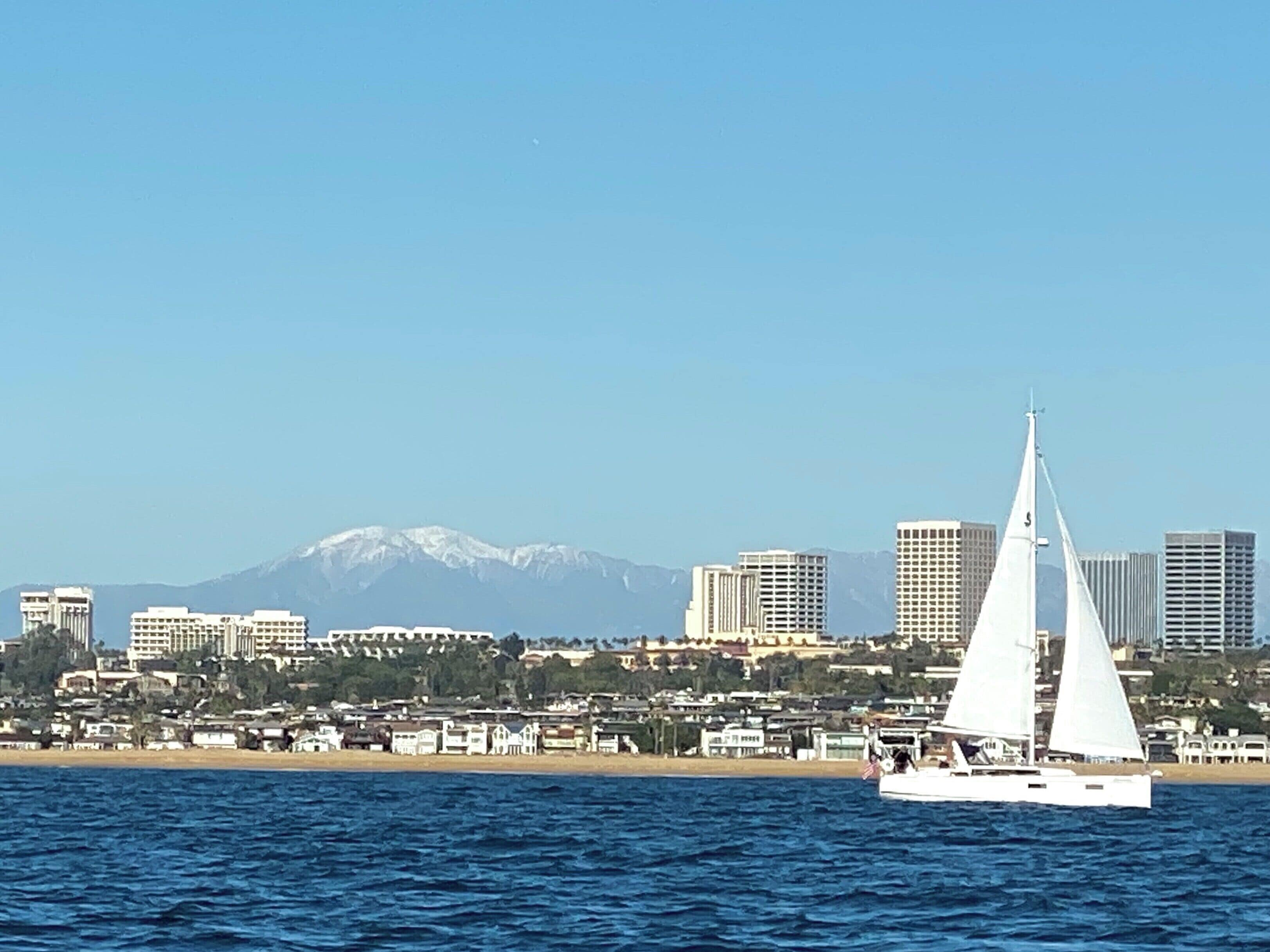 Picture perfect Newport Beach on a brisk December day.  Sea, sand & snowcapped mountains in the background.   #mybackyard