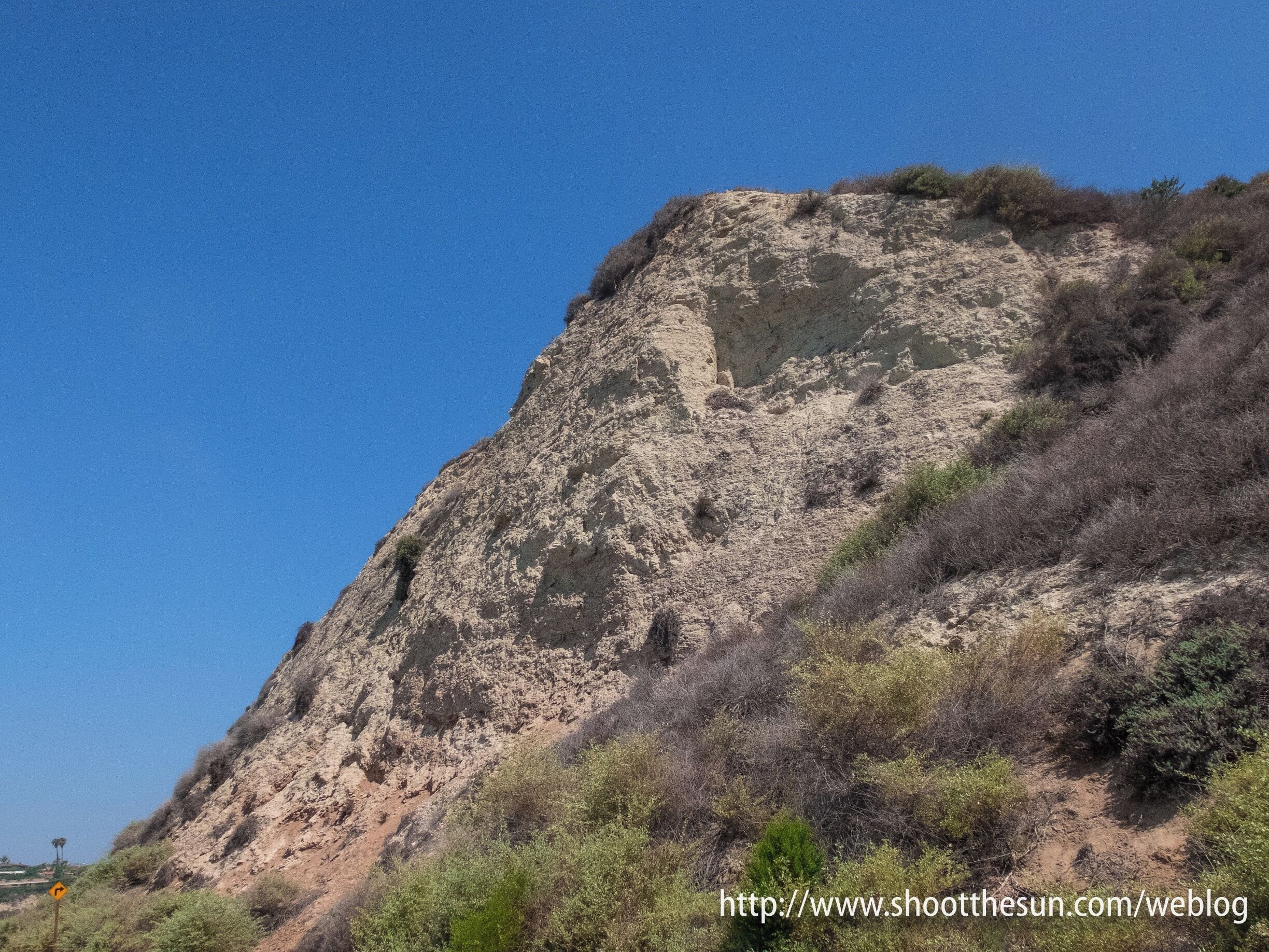 The Preserve was established back in 1975 after a fairly ferocious battle between environmentalists and, well, everybody else.  I doubt there is anyone alive today who regrets the turn of events.

For one thing, huge swaths of land have been preserved [and protected] in pristine form, for another, public access through the place makes it a popular destination for runners, hikers and slow-driving tourists.  

Finally, the surrounding area is almost completely developed for business, high-end residential, and hotel property.

Everybody wins...well, as long as you're willing to keep your head pointed in the direction most suited to your tastes.

It's probably a workable model only where almost everyone is working with a set of unlimited resources and is willing to put them on the line in pursuit of their interests.

A Walden for billionaires, if you wish.  But I gotta admit, it seems to work.