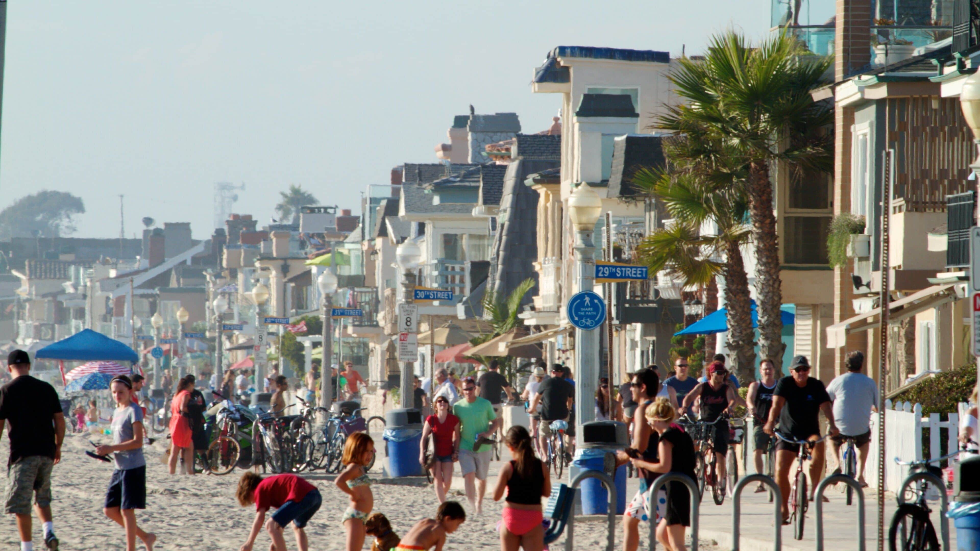 Newport Beach featuring street scenes, tropical scenes and a sandy beach