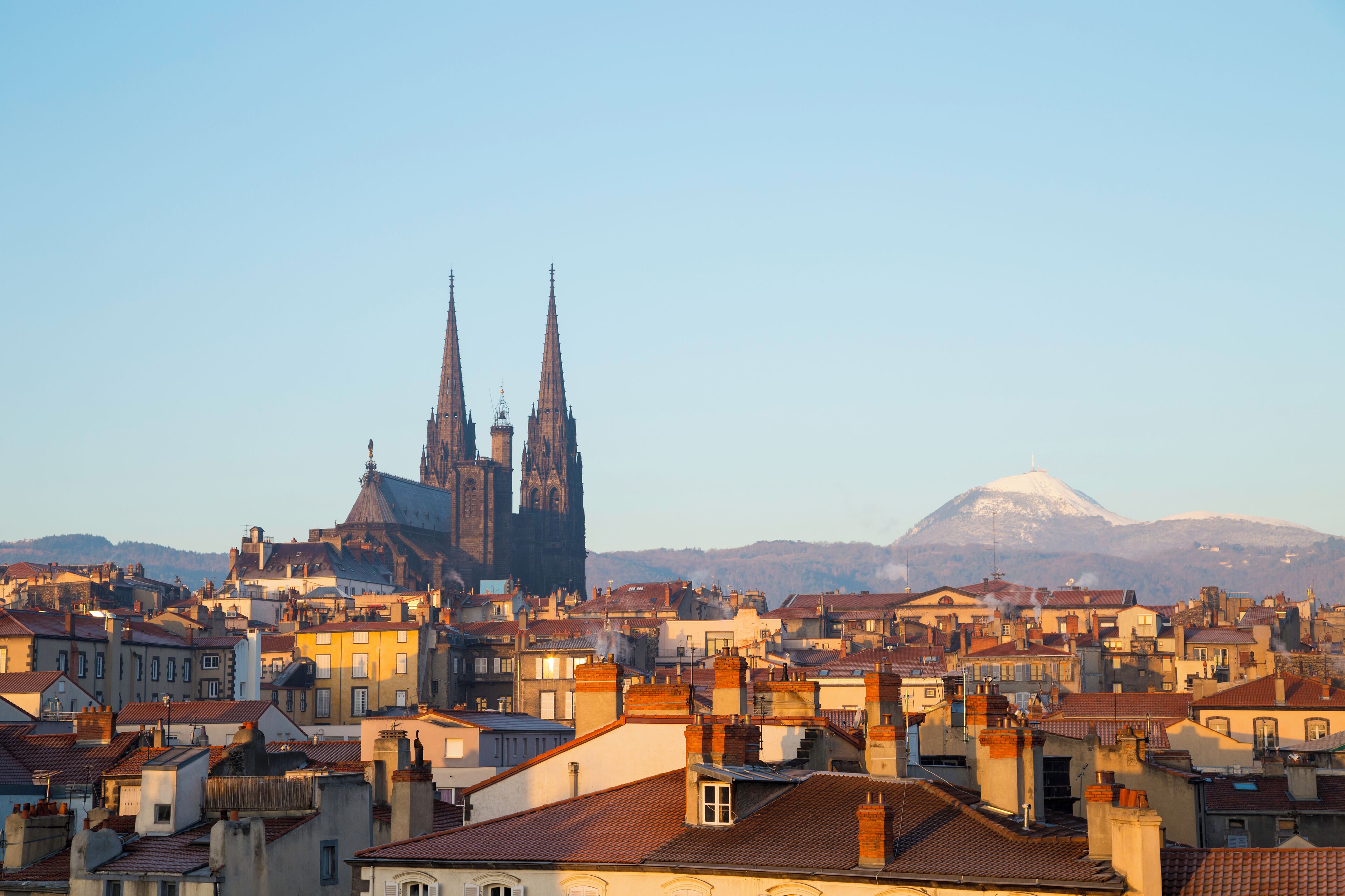 Roof top view of city center and volcano Puy de dome in Clermont ferrand, Auvergne, France