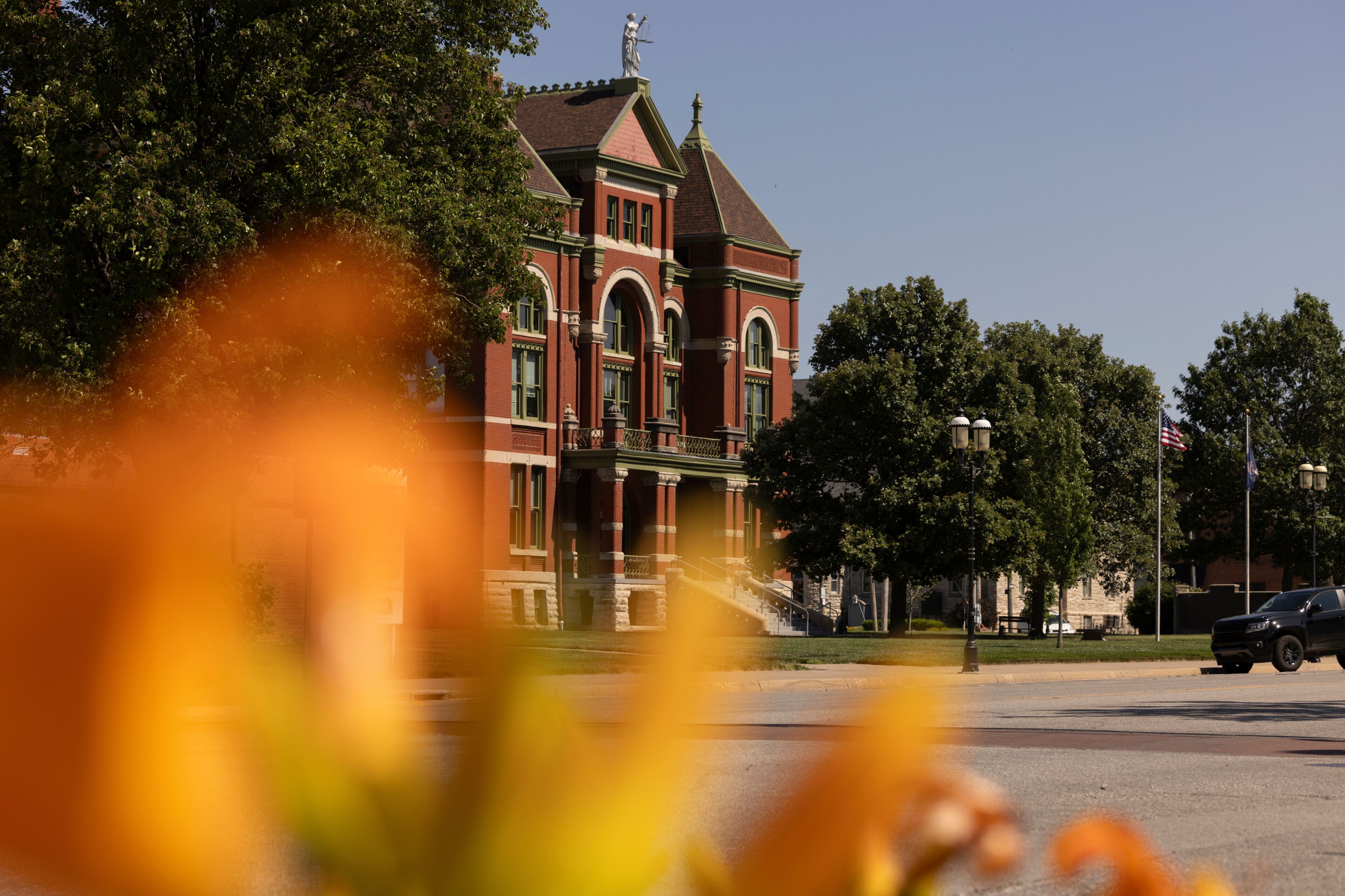 Afternoon sun shines on the historic 19th Century Franklin County Courthouse in downtown Ottawa, Kansas, USA.