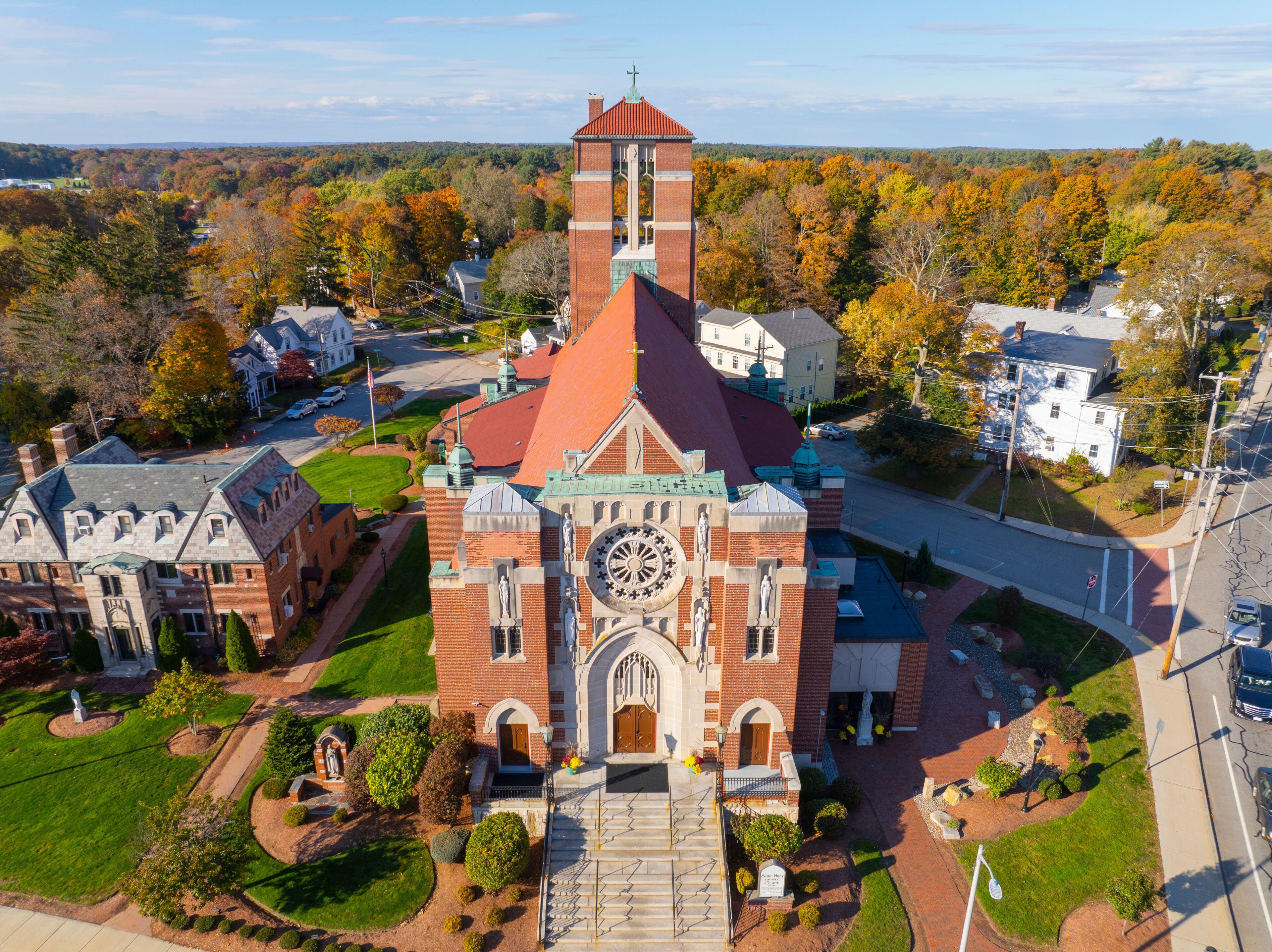 St. Mary's Parish Church aerial view in fall at 1 Church Street at town common in historic town center of Franklin, Massachusetts MA, USA. 