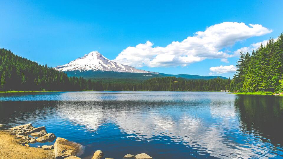 A lake with a mountain in the background.