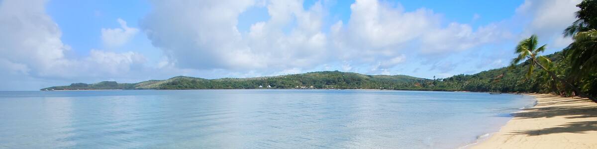 Sandy beach with palm tree shadows, Nananu-i-Ra island, Fiji