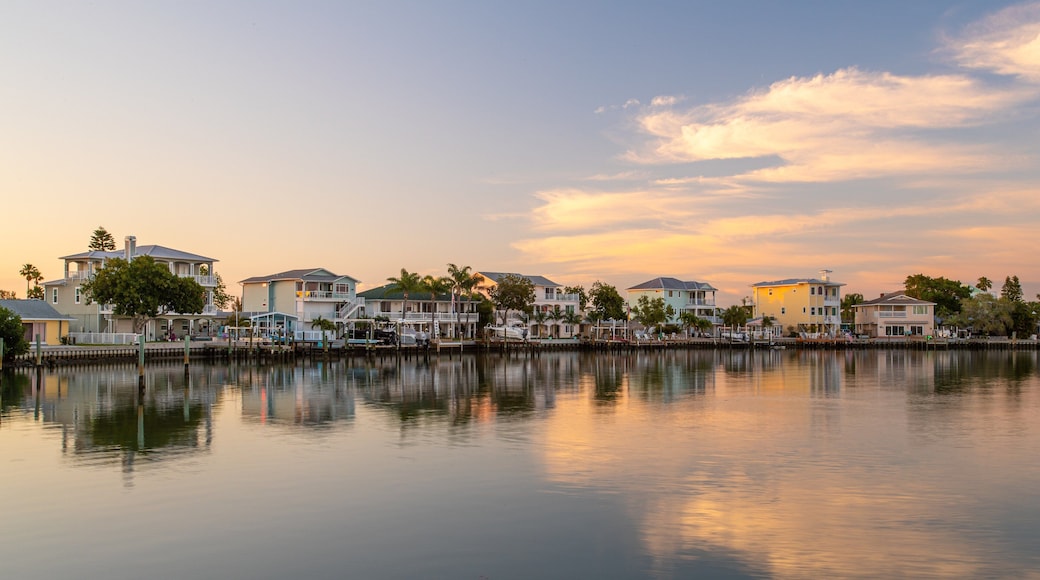 Redington Shores featuring a bay or harbor, a sunset and a house