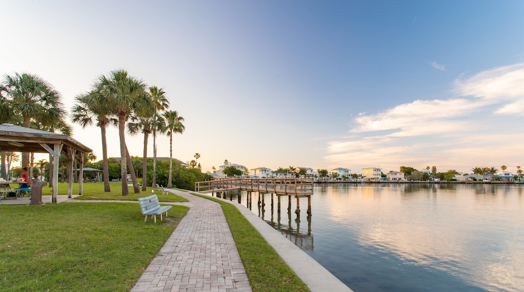 Sunset Reef which includes a park and a bay or harbor
