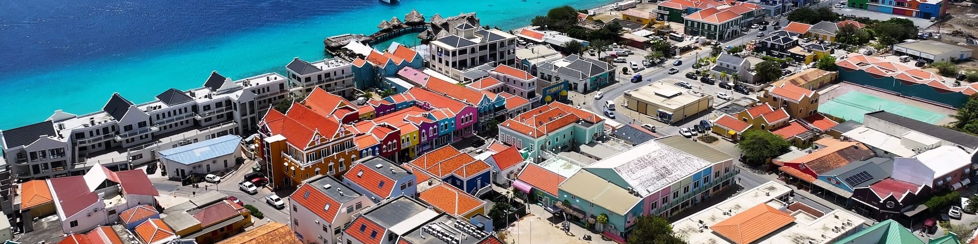 Downtown Bonaire At Kralendijk Bonaire Netherlands Antilles. Aerial Beach Kralendijk Bonaire. Business Clouds Sky Downtown Cityscape. Business Outdoor Downtown Backgrounds Panning Wide.