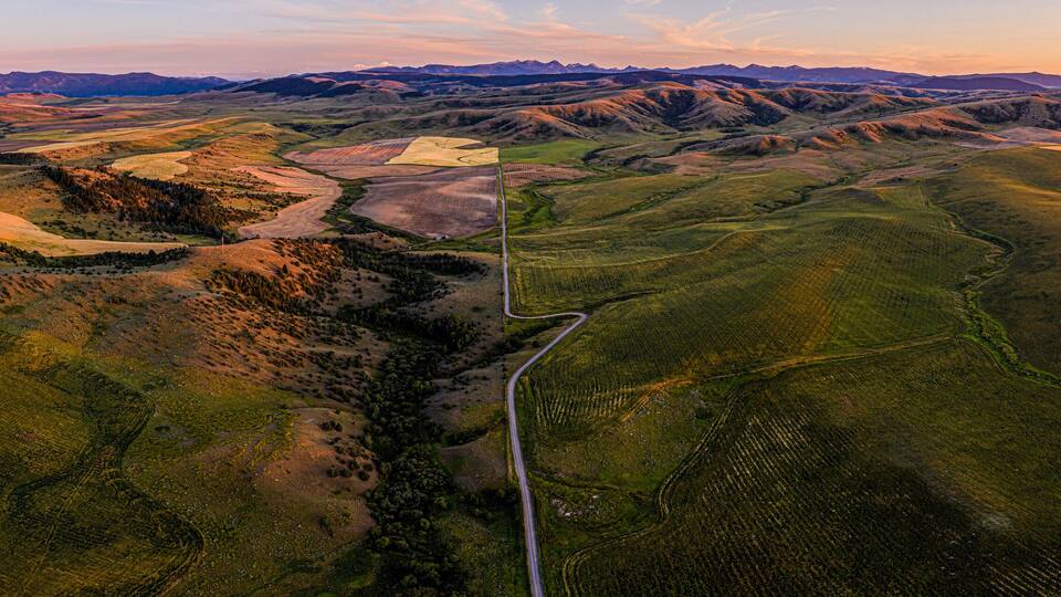 Southwest Montana foothills farmland fields patchwork panorama at sunset - Gallatin Valley - Spanish Peaks - Rocky Mountains