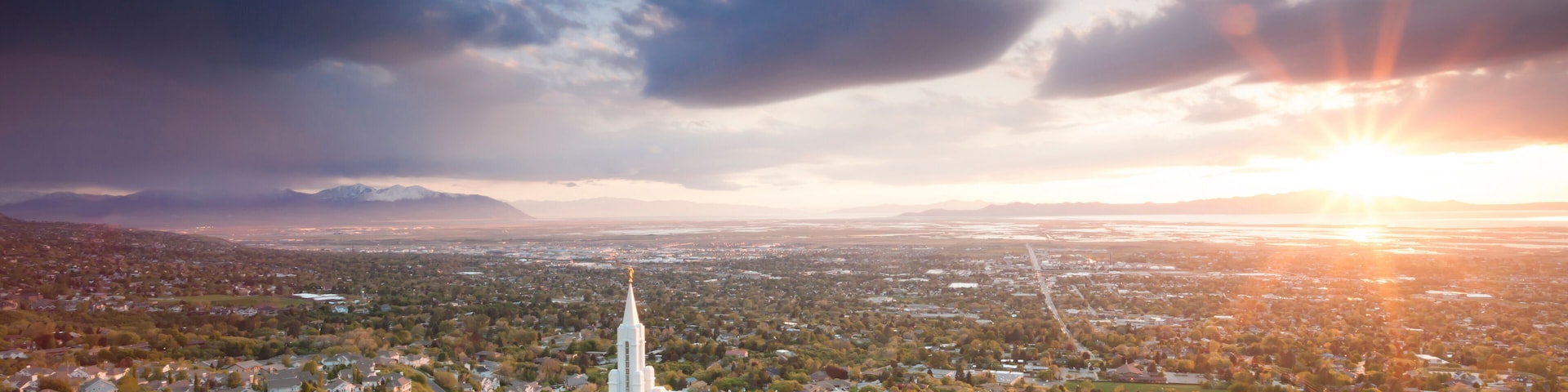 The Mormon (LDS) Temple in Bountiful Utah sits above the Great Salt Lake at dusk.