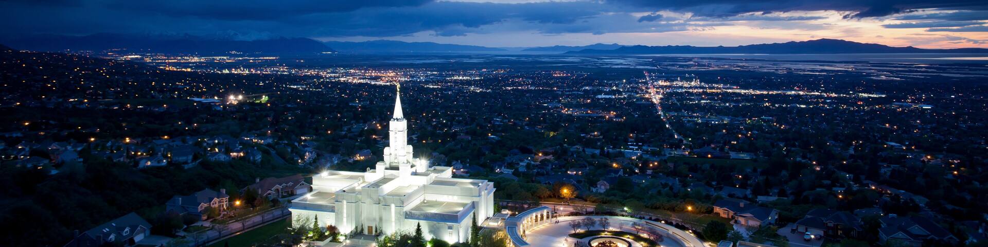 The Mormon (LDS) Temple in Bountiful Utah sits above the Great Salt Lake at dusk.