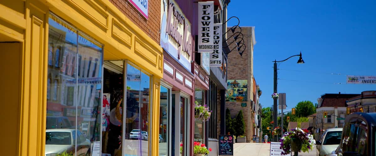 A street with flower shops and a sign for a wedding florist.