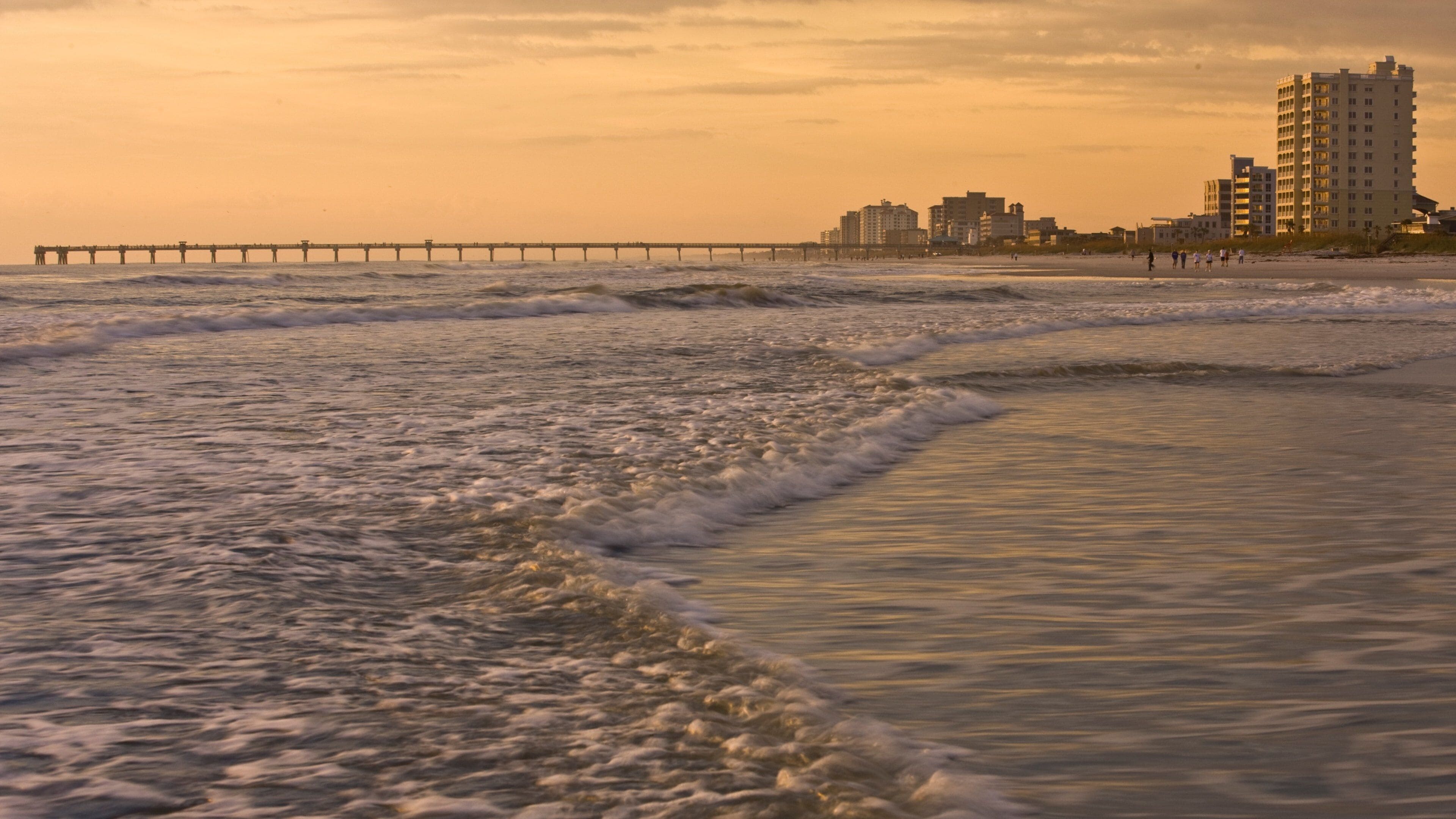 Jacksonville Beach which includes waves, general coastal views and skyline