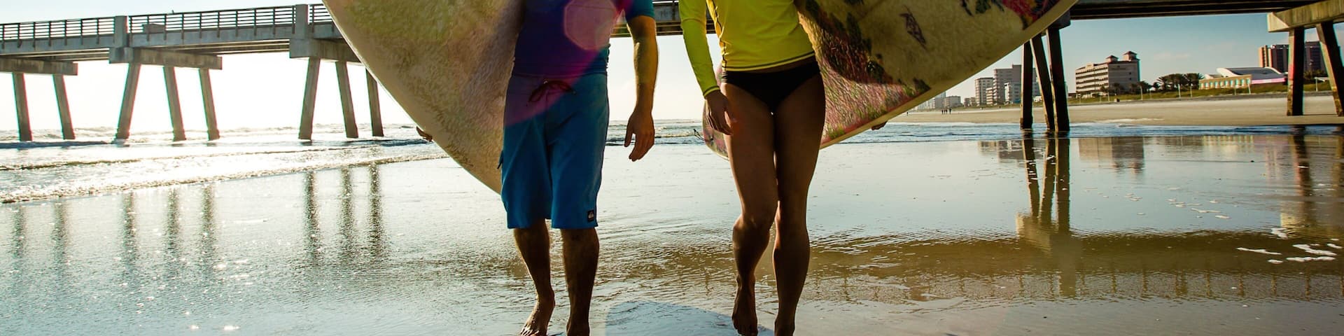 Jacksonville Beach showing a beach, surfing and views