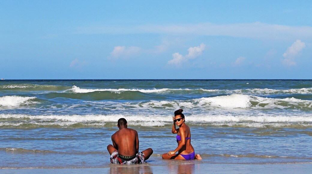 My cousins soaking in the sand on a humid July day in Jacksonville