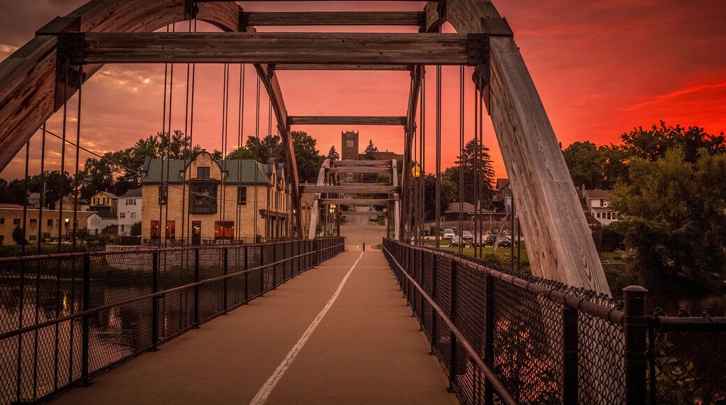 The arched walk bridge in Jefferson, Wisconsin and a red sunset
