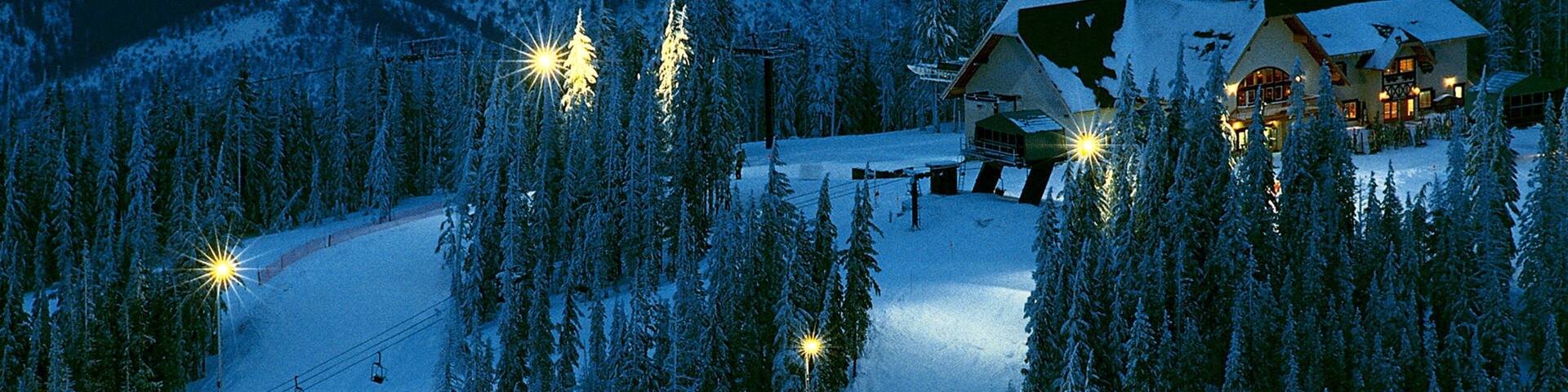 Kellogg featuring night scenes, snow and a gondola