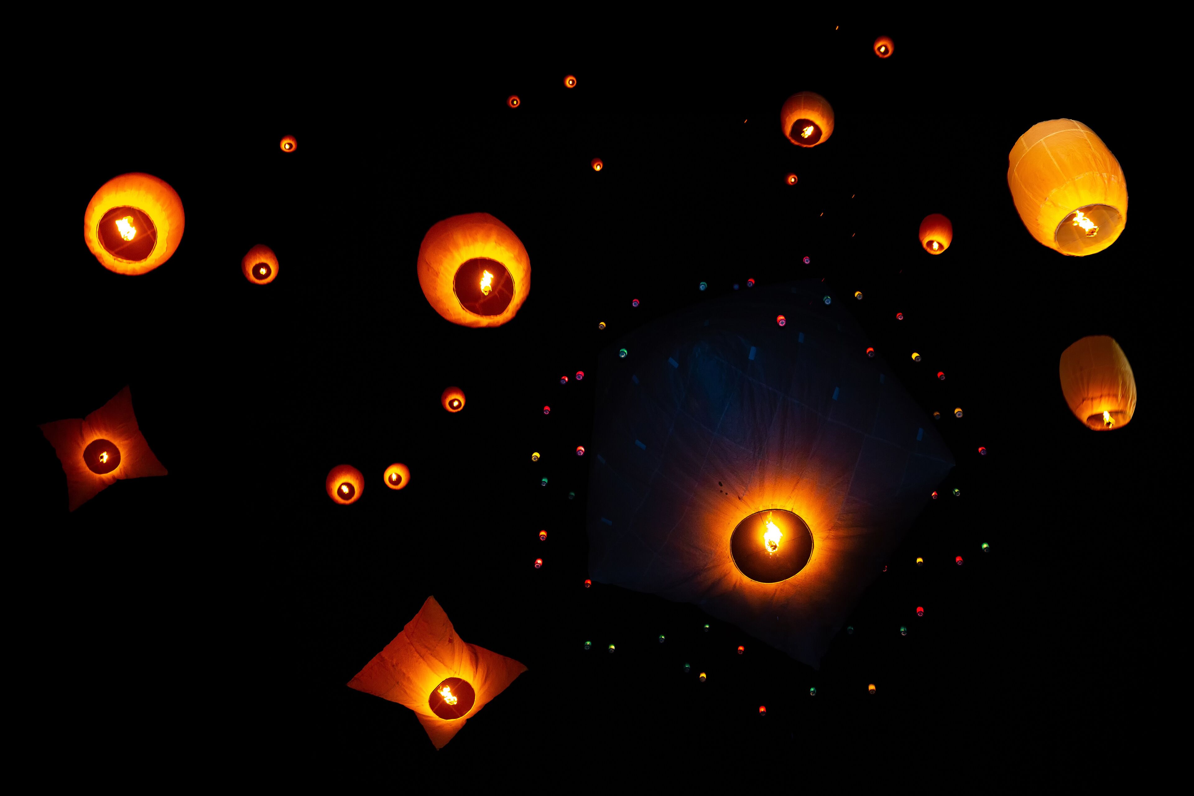 Beautiful views of lanterns being released into the dark sky during Probarona Purnima festival at Rajguru Buddhist Temple, keang mor, Bandarban, Bangladesh.
