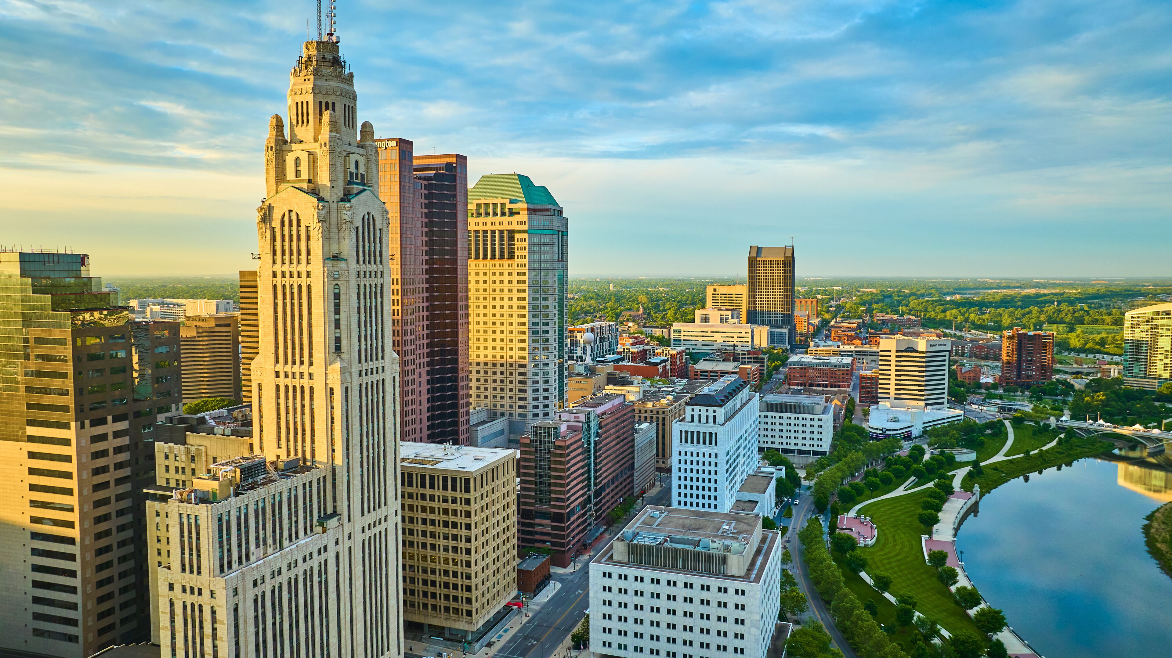 Columbus Ohio heart of downtown aerial at sunrise with iconic buildings and Scioto River