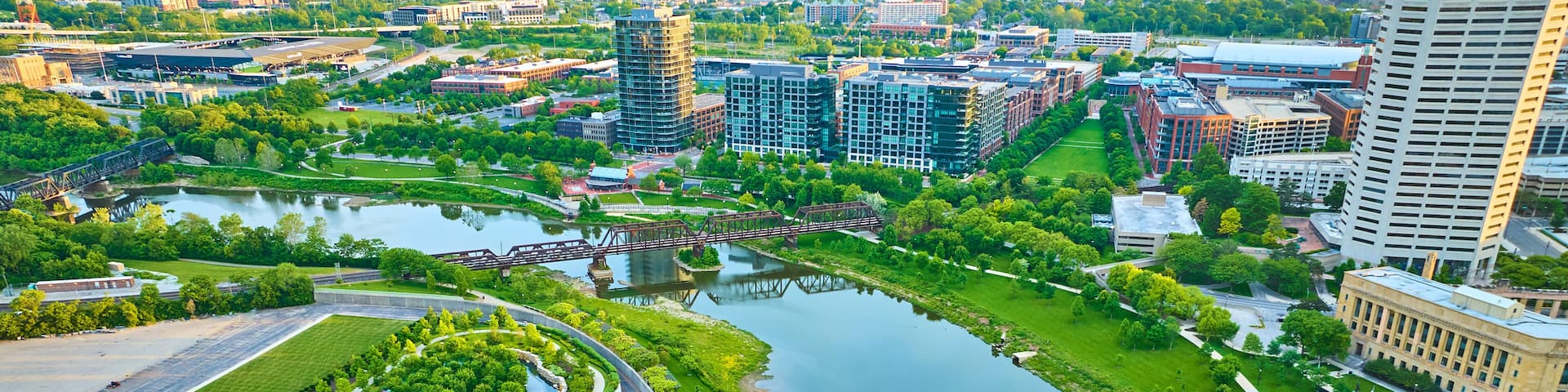 Aerial National Veterans Memorial and Museum at sunrise and Columbus city across river