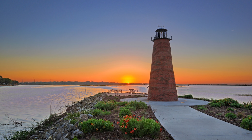 Dawn view over Lake Toho (Lake Tohopekaliga) in Kissimmee Florida including walkway and mini lighthouse.