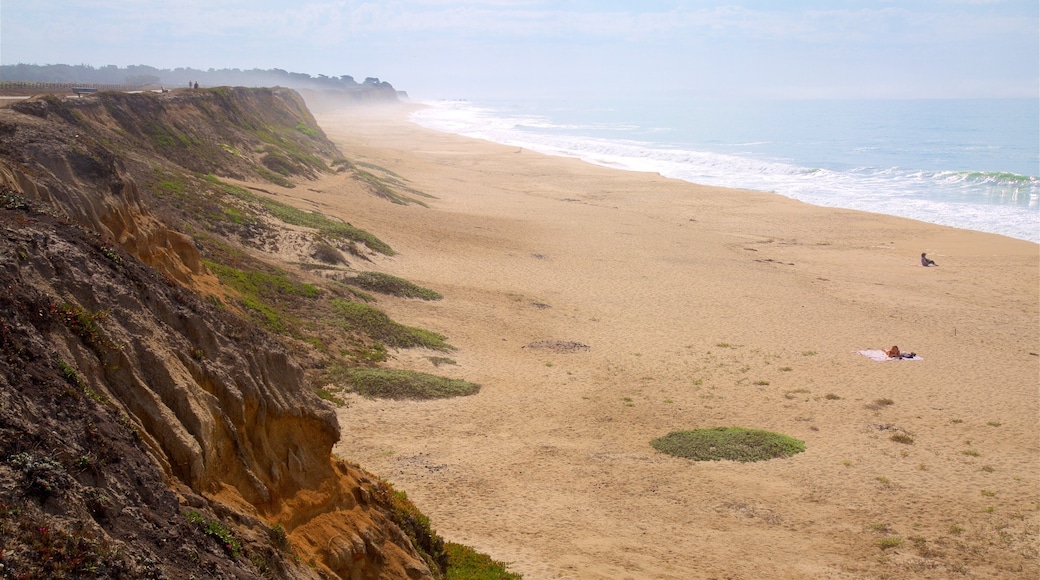 Half Moon Bay which includes a beach and general coastal views