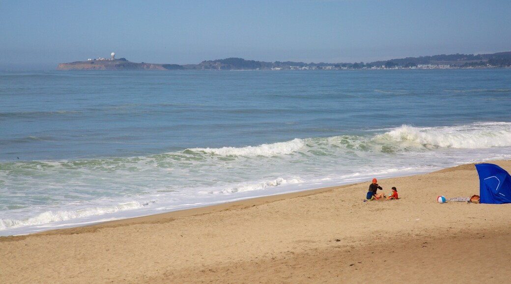 Half Moon Bay featuring general coastal views and a sandy beach as well as children