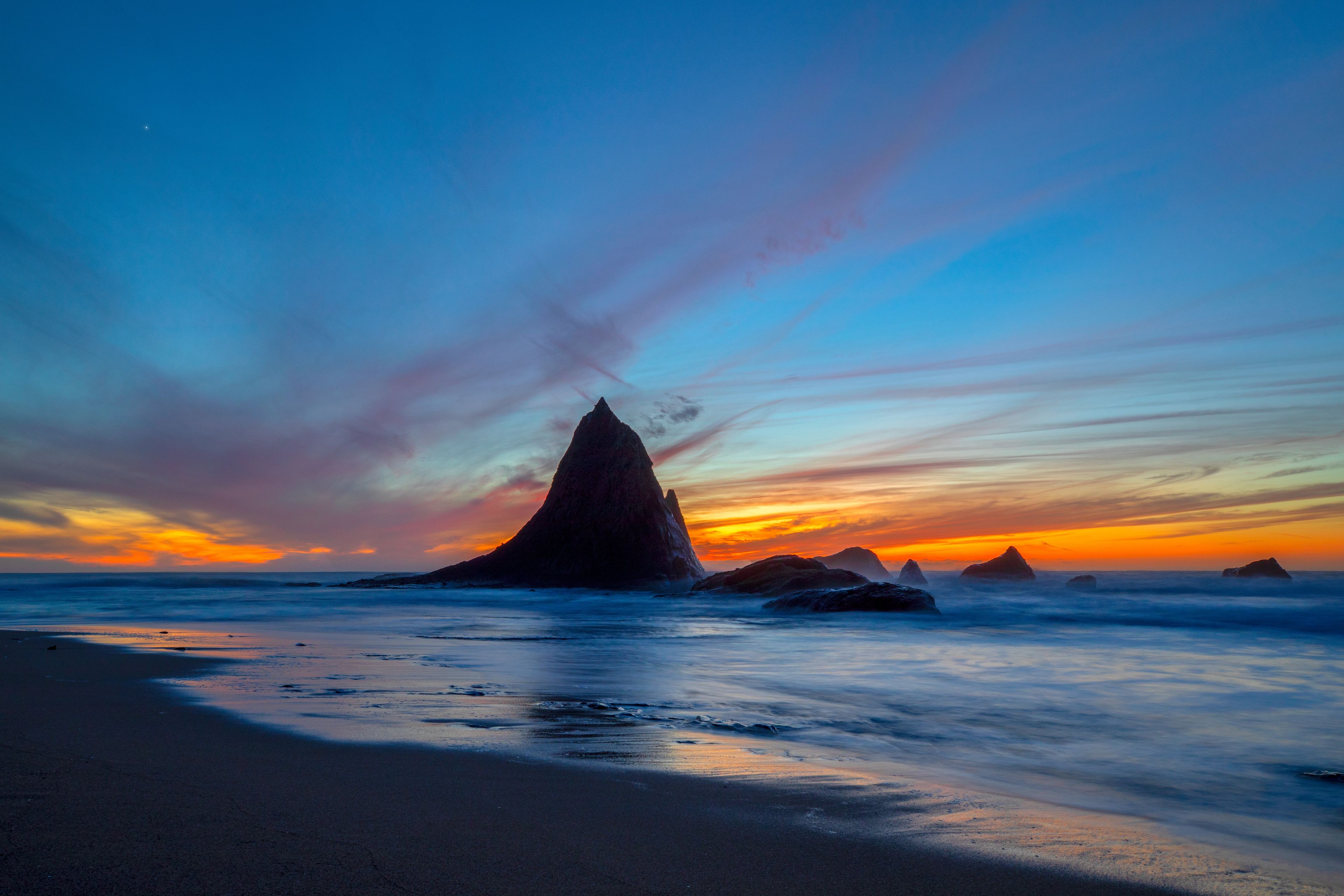 Dusk at Martin's Beach and Shark Fin Rock near Half Moon Bay, Northern California, USA