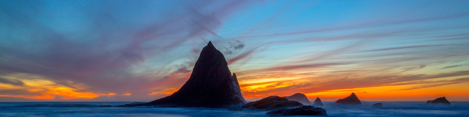 Dusk at Martin's Beach and Shark Fin Rock near Half Moon Bay, Northern California, USA