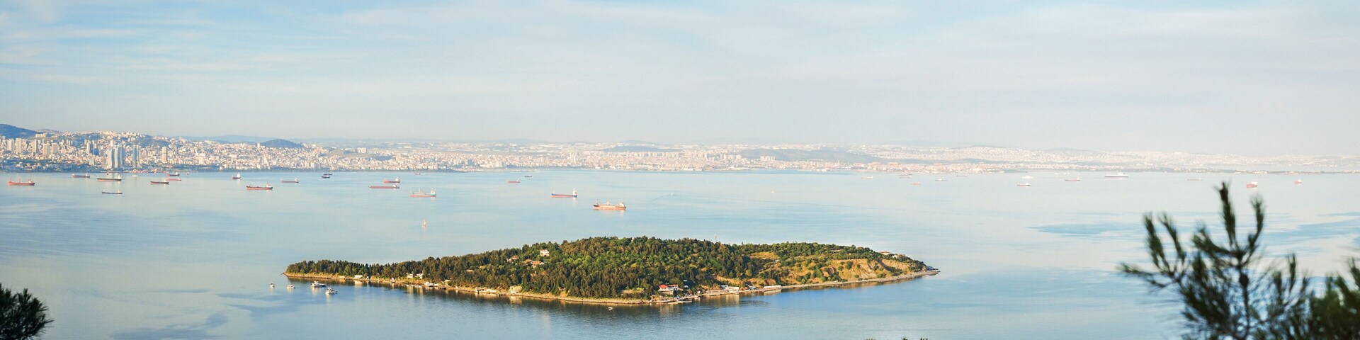 Panoramic view of Sedef Island (Mother of Pearl Island) framed by green trees from Buyukada island. Sedef Island (turkish: Sedef adasi) is a neighbourhood in the Adalar district of Istanbul, Turkey.