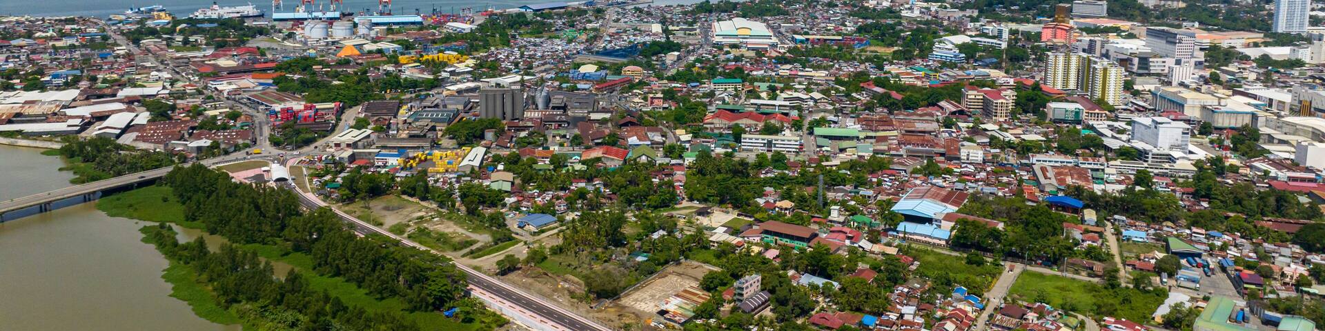 Coastline City with modern buildings and highway of Cagayan de Oro in Mindanao, Philippines.