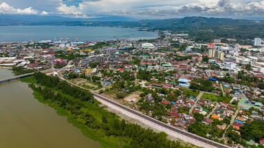 Coastline City with modern buildings and highway of Cagayan de Oro in Mindanao, Philippines.