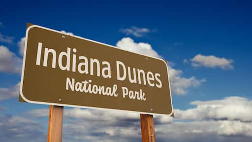 Indiana Dunes National Park (Indiana) Road Sign Against Blue Sky and Clouds.