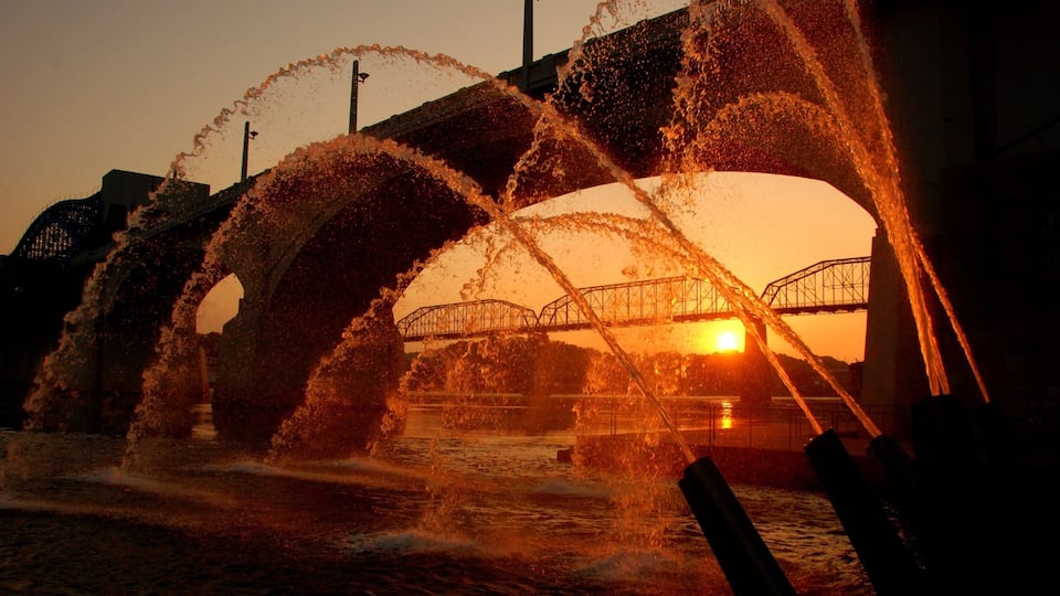 Water cannons at sunrise.