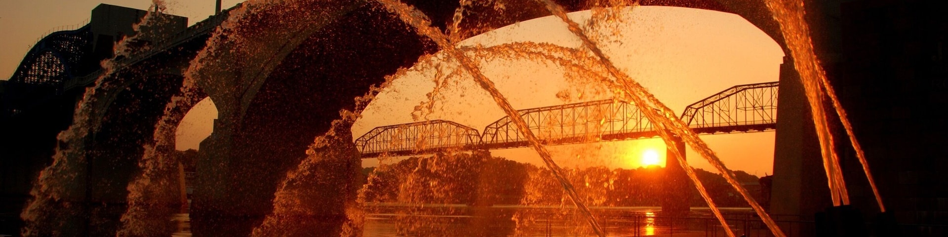 Water cannons at sunrise.
