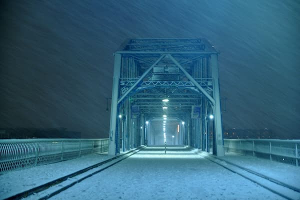Snowing on the walking bridge.