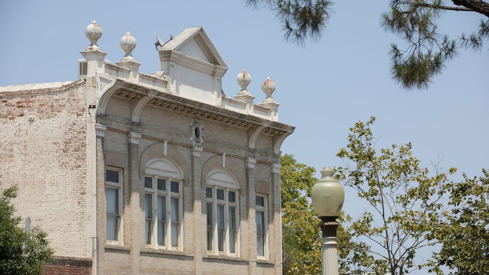 A historic building with arched windows and decorative finials.
