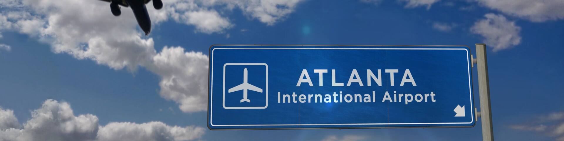 Plane landing in Atlanta with signboard